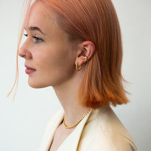 Load image into Gallery viewer, picture of model wearing chumani connected hoop earrings

